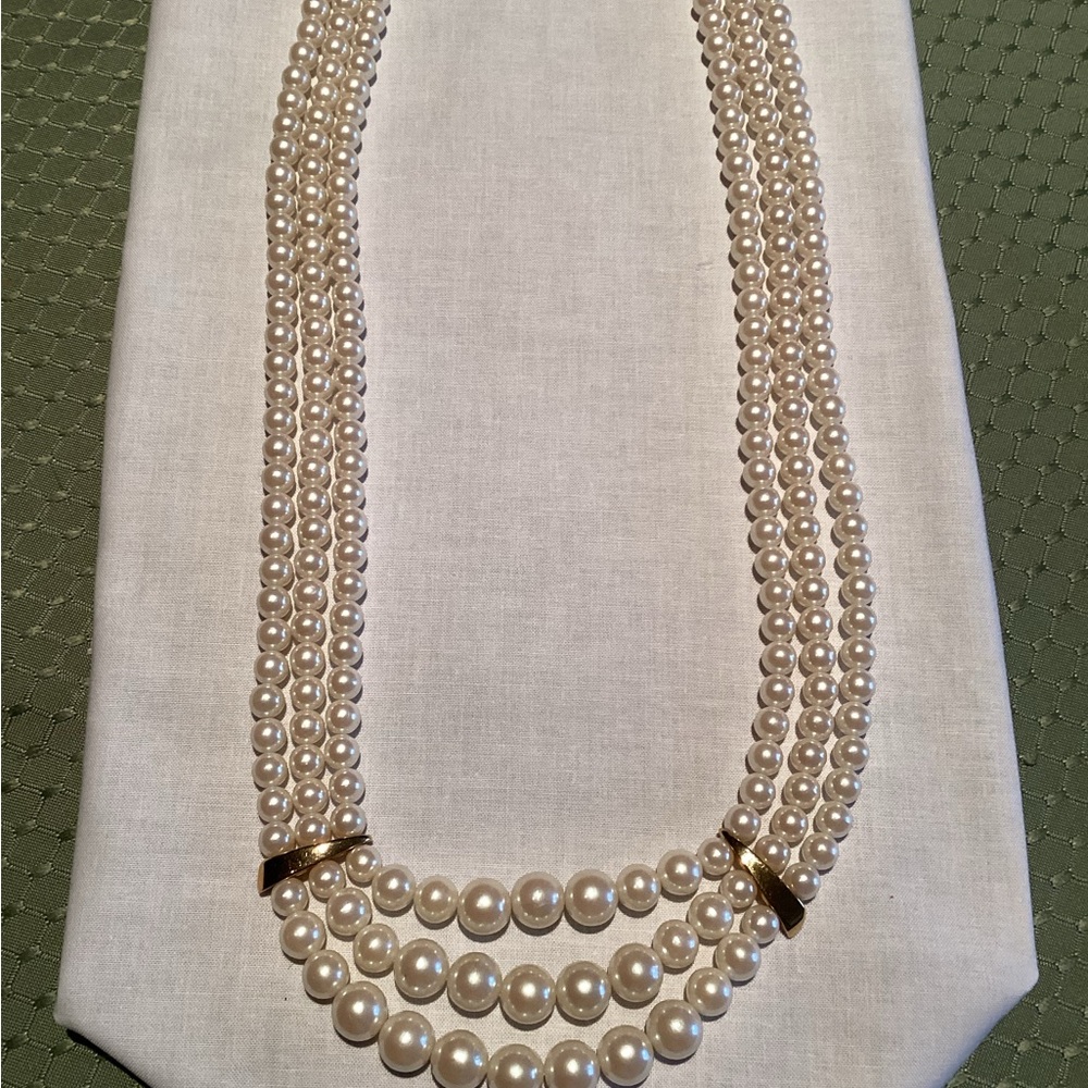 Fashion Necklace with Three Strands of Faux Pearls with Gold Tone Clasps.
